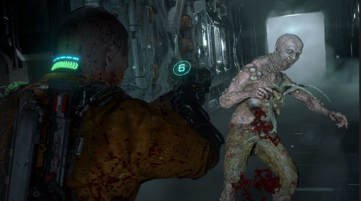 Jacob Lee aims a gun at an enemy in The Callisto Protocol