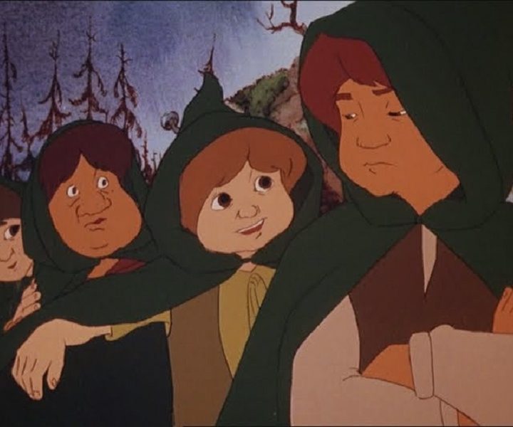 Four hobbits stand next to each other in a scene from The Lord of the Rings.