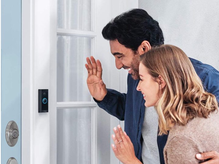 Two people saying hi with a Ring Video Doorbell Wired.
