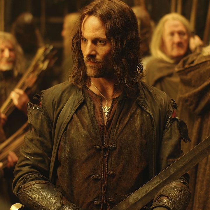 Viggo Mortenson holds a sword in a scene from The Two Towers.