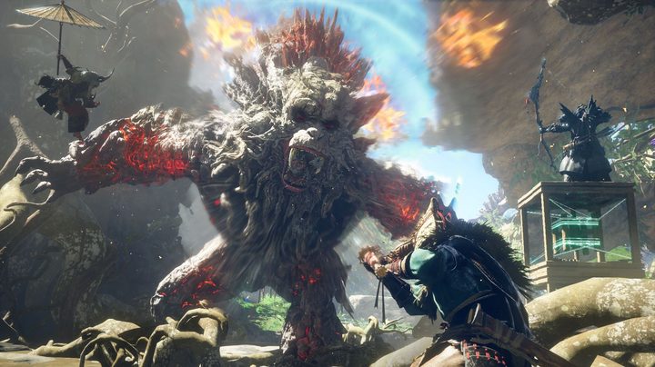 Three players build to fight a monster in Wild Hearts.