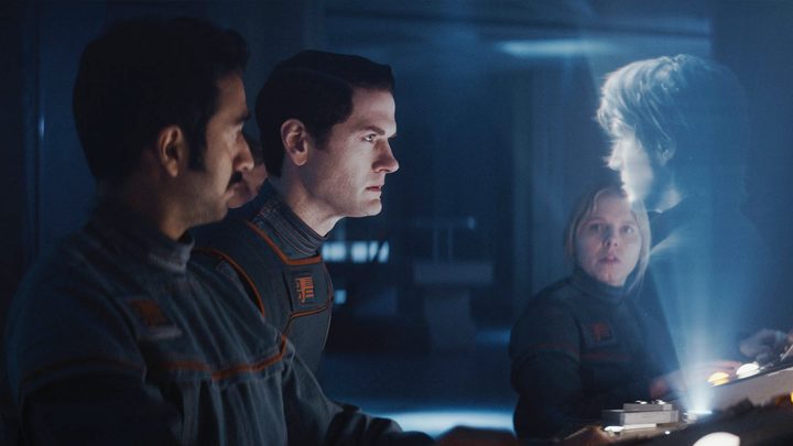 A man looks at a hologram in Andor.