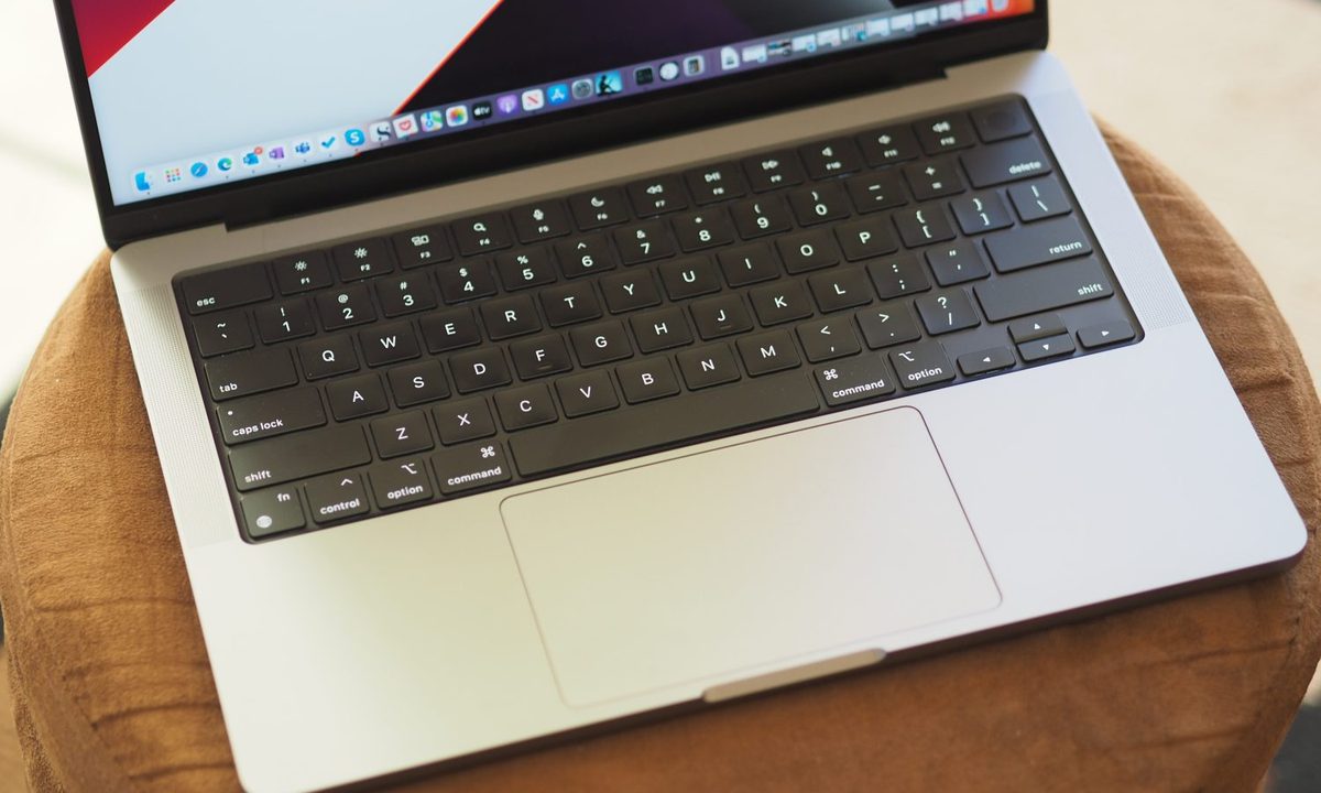 Apple MacBook Pro 14 top down view showing keyboard and touchpad.