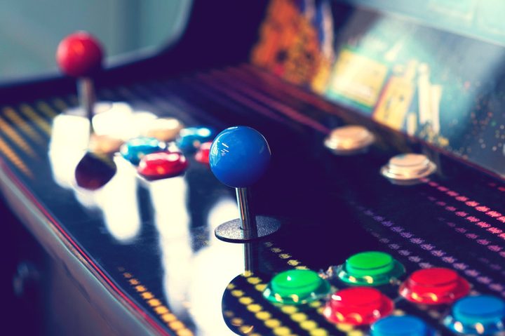 closeup on an arcade game's controls