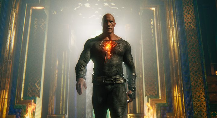 Dwayne Johnson strides toward the camera as Black Adam.