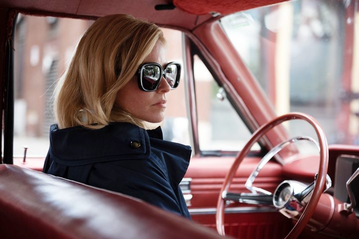 Elizabeth Banks sits in a car in Call Jane.