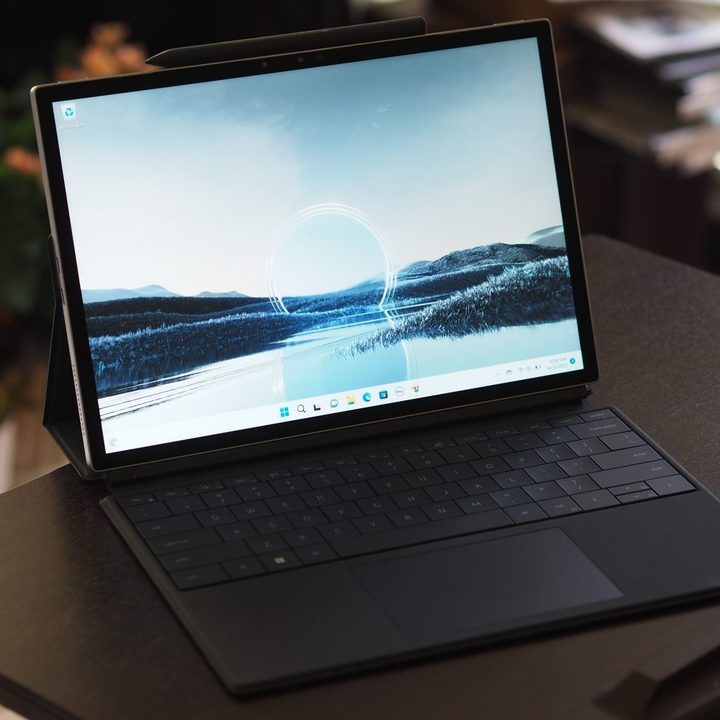Dell XPS 13 2-in-1 front angled view showing display and folio keyboard.