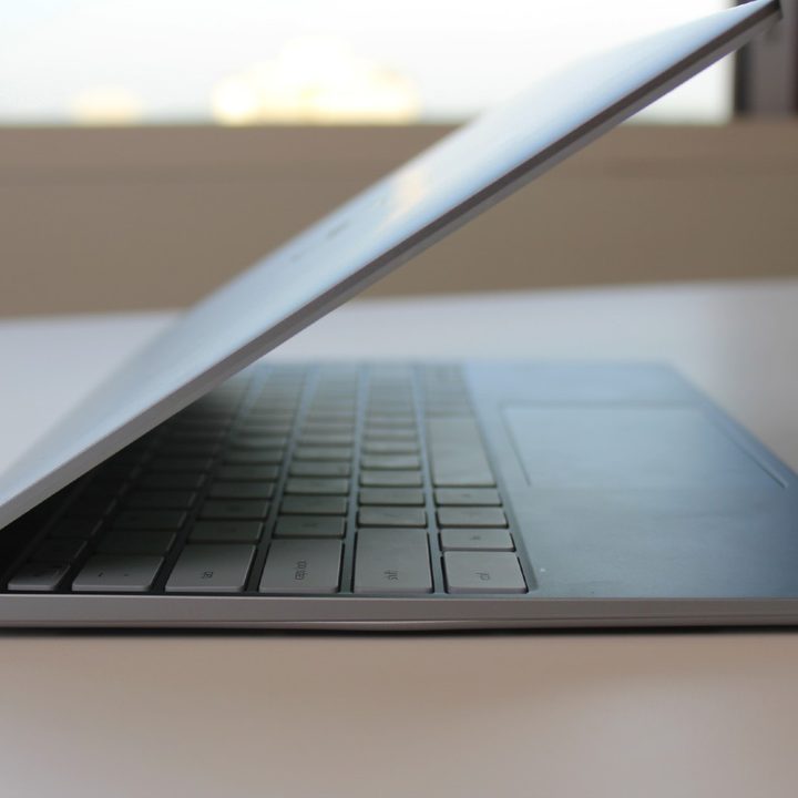 The side of the Dell XPS 13 on a table.