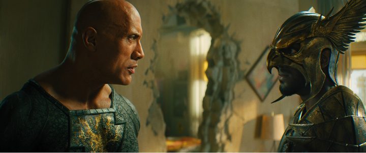 Dwayne Johnson stares at Aldis Hodge in a scene from Black Adam.