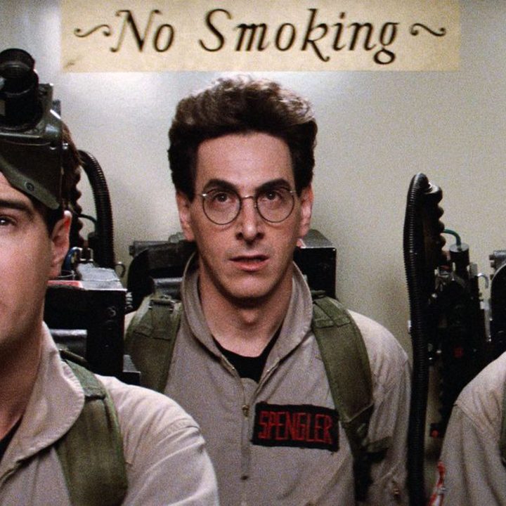 The three main characters from the original Ghostbusters film in full outfits.
