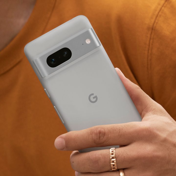 Someone holding a white Google Pixel 7.