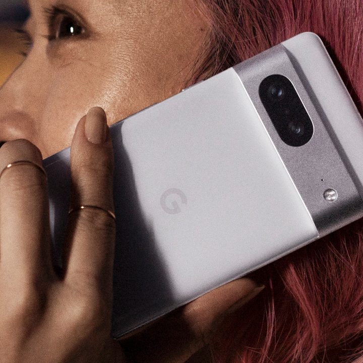 Someone holding a white Google Pixel 7.