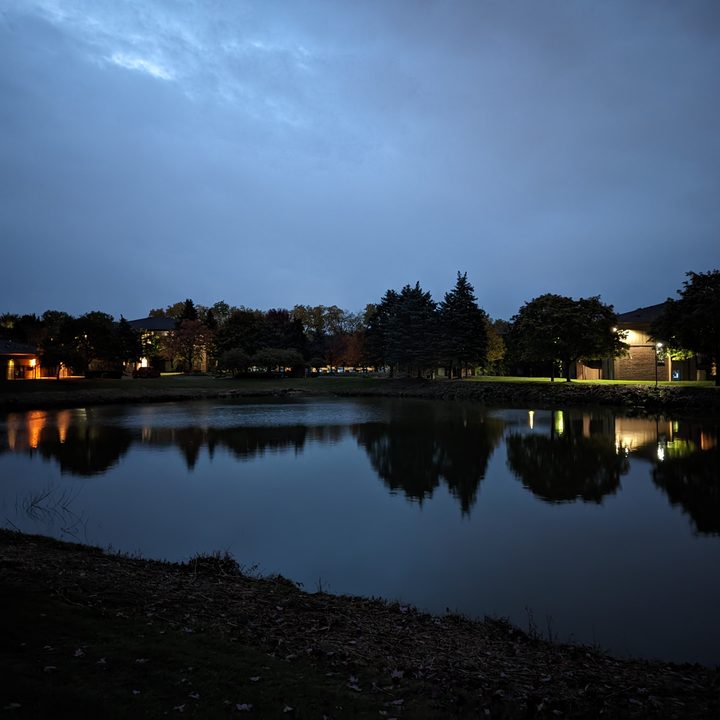 A photo of a dark sky and pond, taken with the Pixel 7 Pro.