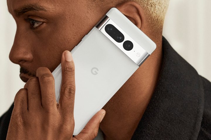 Someone holding a white Google Pixel 7 Pro.