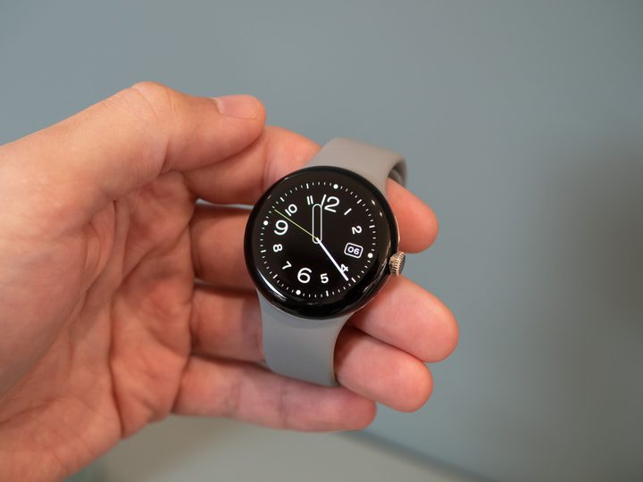 Google Pixel Watch with grey strap.