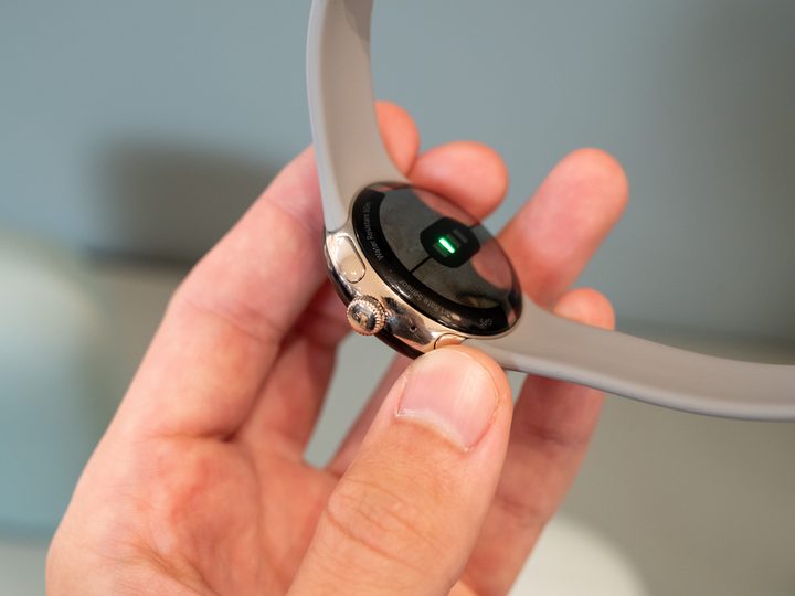 Google Pixel Watch with grey strap.