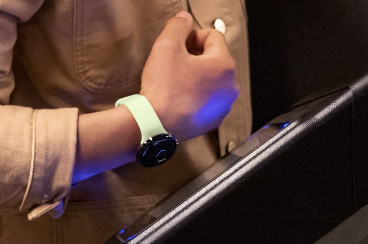 Someone using NFC to pay with the Google Pixel Watch.