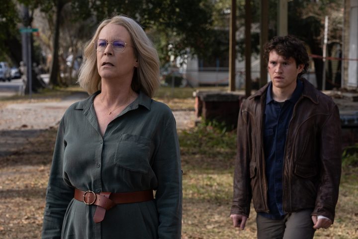 Jamie Leee Curtis walks away from Rohan Campbell in a park in a scene from Halloween Ends.