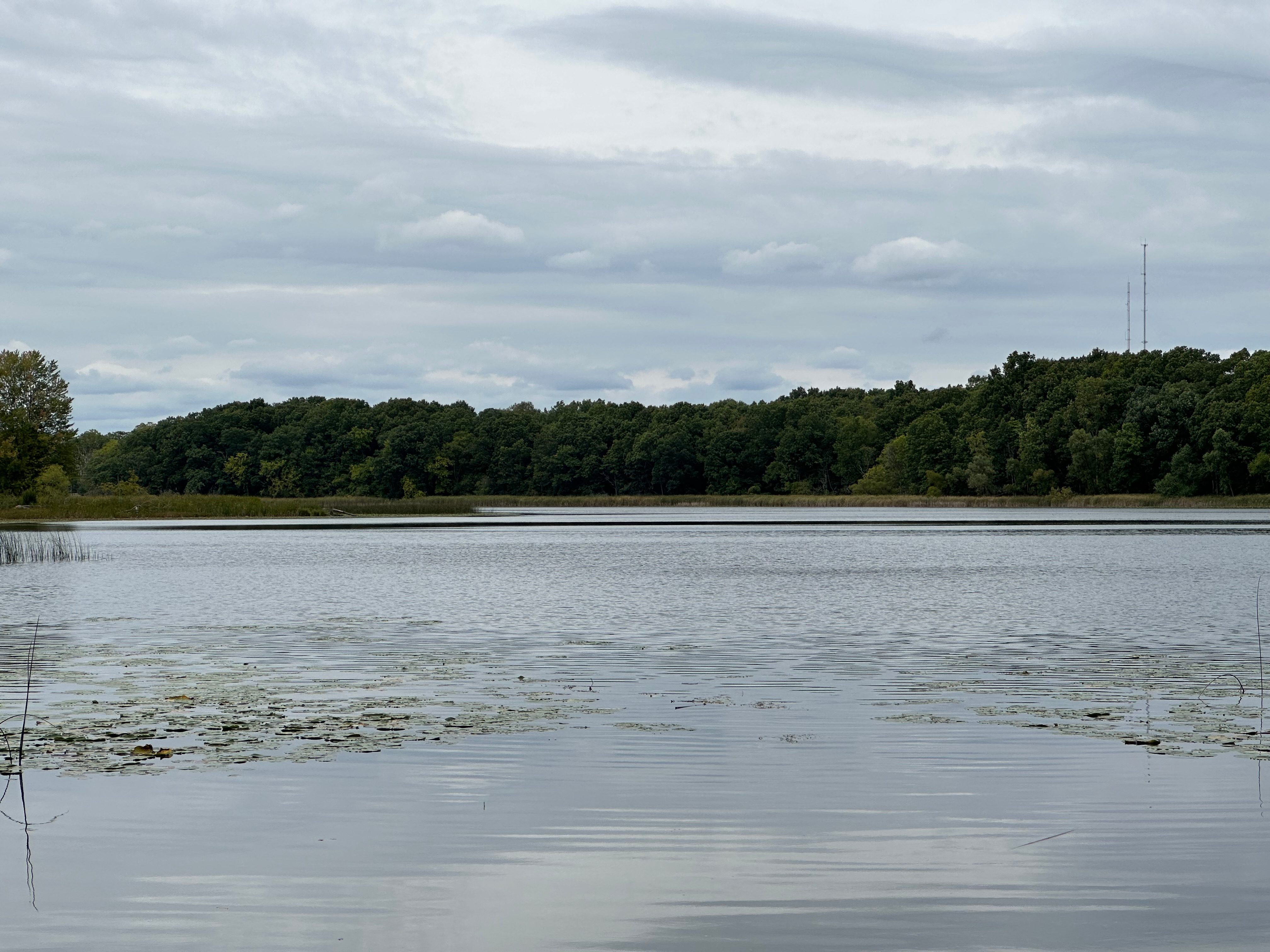 A photo of a lake and trees, taken with the iPhone 14 Pro Max.