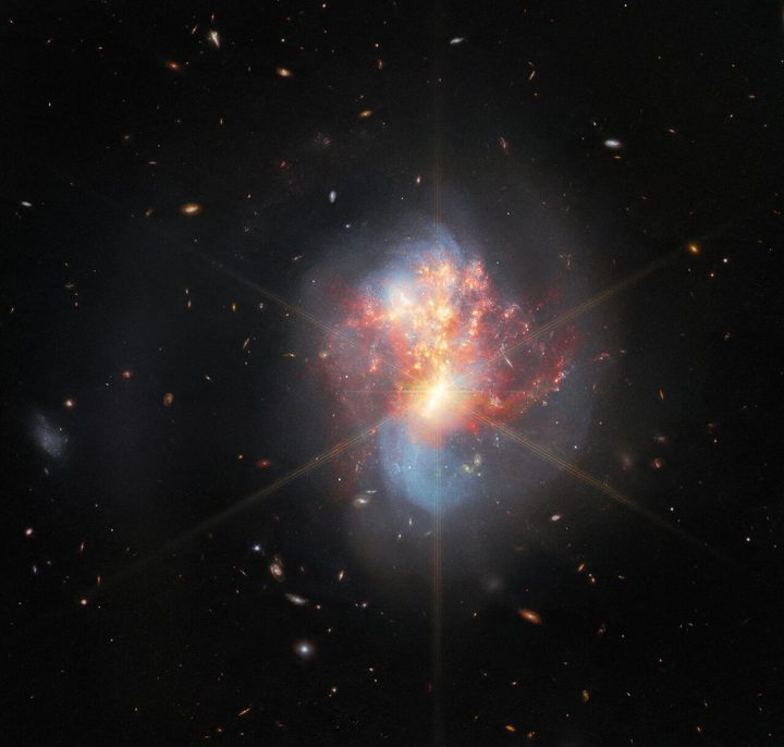 This image from the NASA/ESA/CSA James Webb Space Telescope depicts IC 1623, an entwined pair of interacting galaxies which lies around 270 million light-years from Earth in the constellation Cetus. The two galaxies in IC 1623 are plunging headlong into one another in a process known as a galaxy merger. Their collision has ignited a frenzied spate of star formation known as a starburst, creating new stars at a rate more than twenty times that of the Milky Way galaxy.