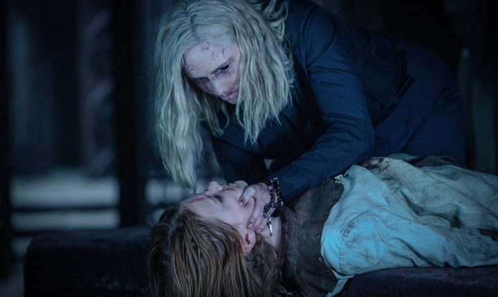 A woman leans over a girl in Prey for the Devil.