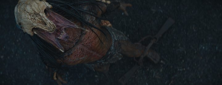 An overhead camera shot of the Predator roaring from the film Prey, before visual effects are applied.