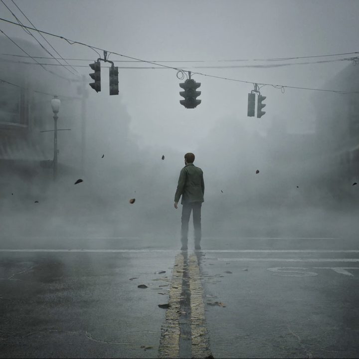 Silent Hill 2's hero stands in a foggy street.