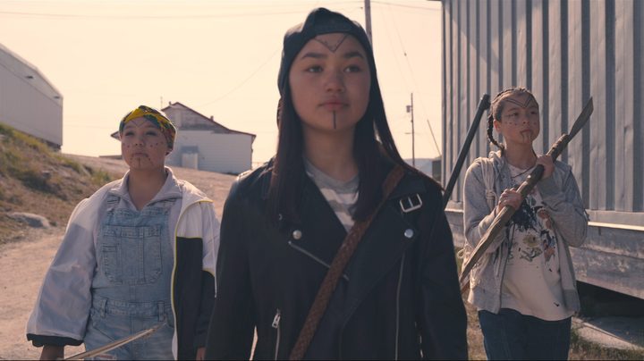 Three girls, each armed with different weapons, go looking for alien invaders in a scene from Slash/Back.