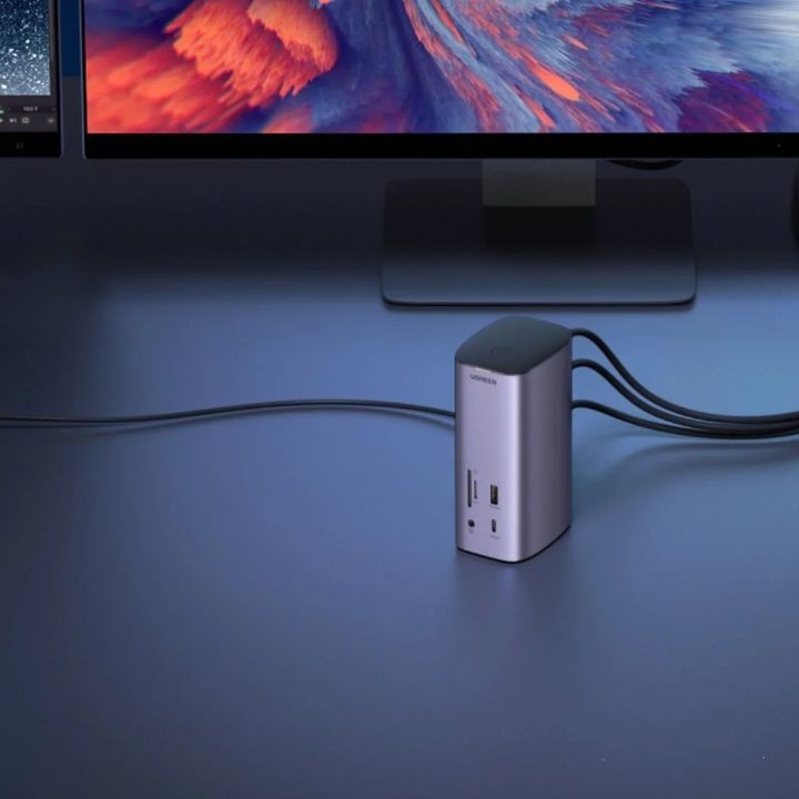 The Ugreen docking station, connected to a MacBook and displays.