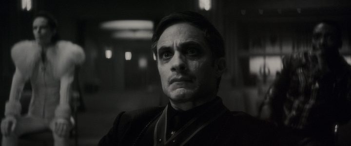 Gael Garcia Bernal stares intently in a black and white scene from Werewolf By Night.
