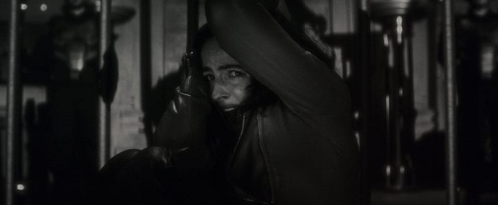 Laura Donnelly looks into the camera in a scene from Werewolf By Night.