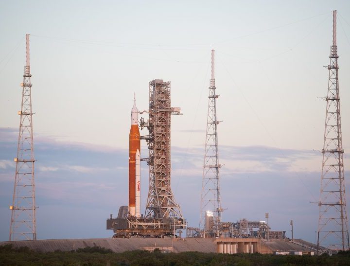 NASA’s Space Launch System (SLS) rocket with the Orion spacecraft aboard is seen atop the mobile launcher as it arrives at Launch Pad 39B.