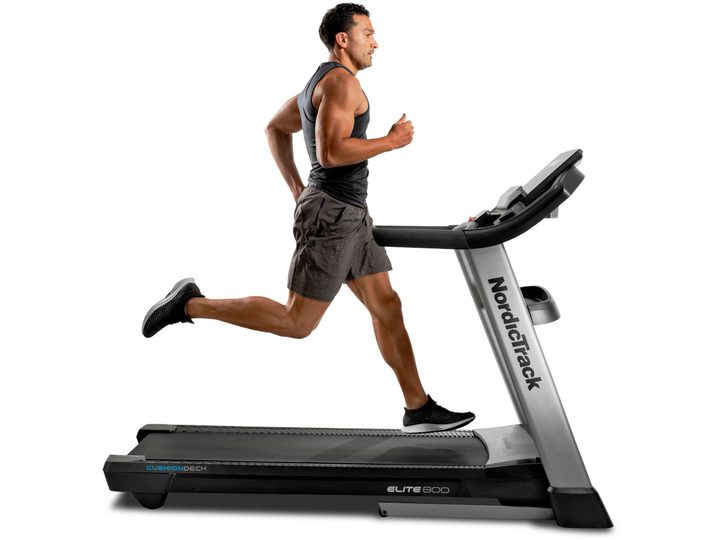 A man running on a NordicTrack Elite 800 Treadmill.