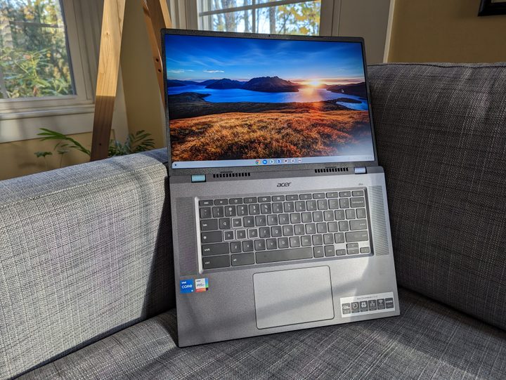 Acer 516 GE on couch with lid opened to 180 degrees.