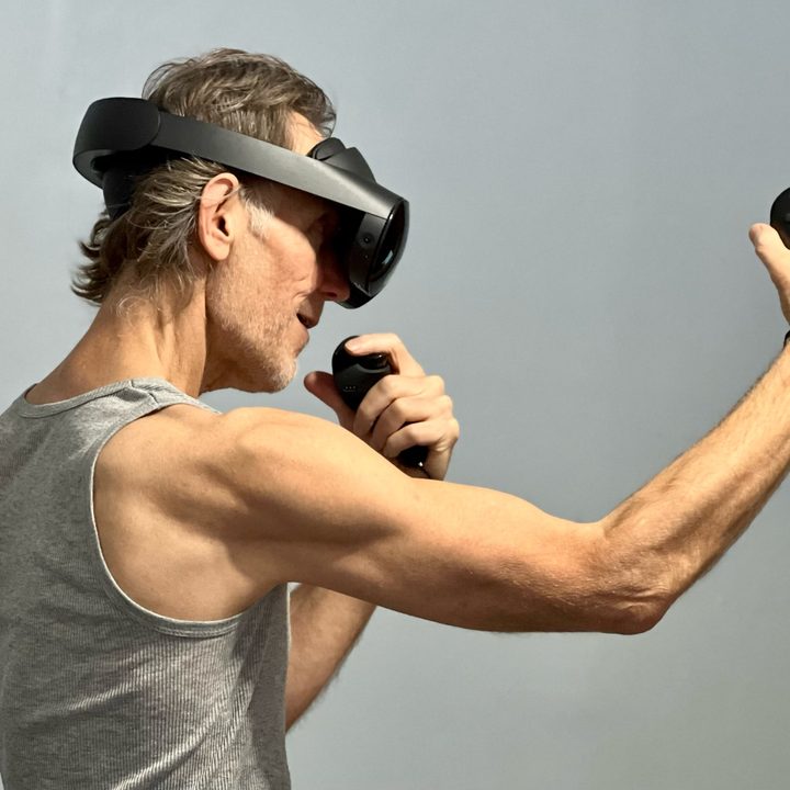Playing a fitness game in VR with the Quest Pro.