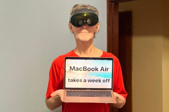 Alan Truly is wearing his Quest Pro and holding a laptop with a message: M1 MacBook Air gets the week off.