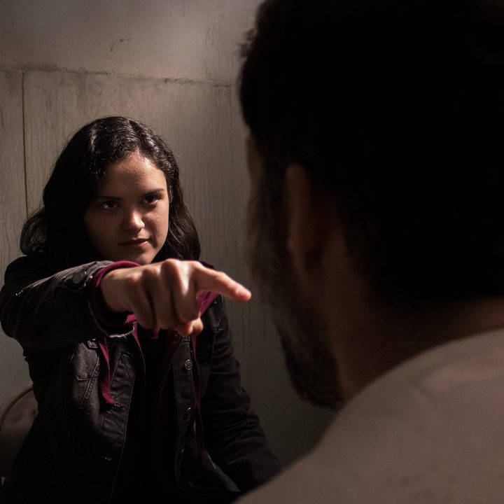 A girl points her finger in a scene from Blood Relatives.