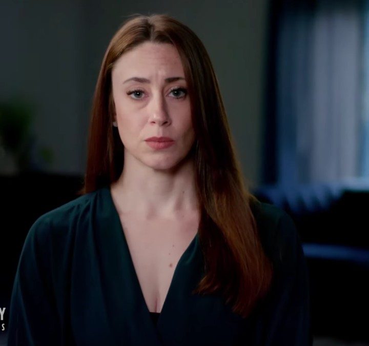Casey Anthony sits down and stares in a scene from Where The Truth Lies.