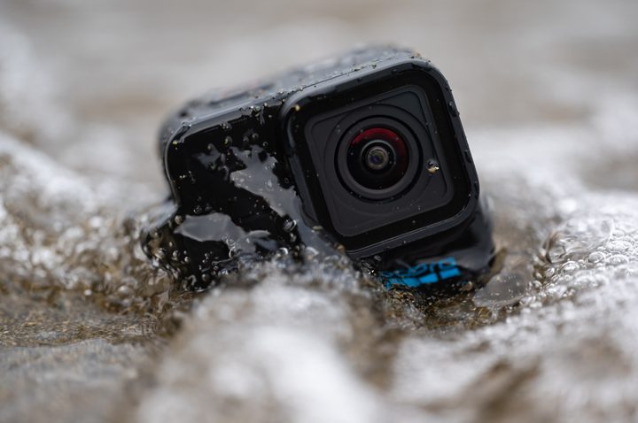 The GoPro Hero 11 Mini getting hit by a wave.