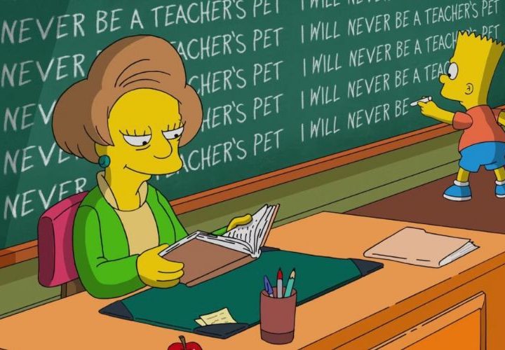 Edna Krabappel sits at her desk as Bart writes on the chalkboard