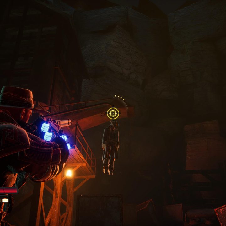 Jessie aims up to shoot a corpse hanging from a rope