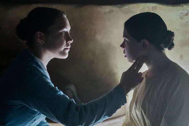 Florence Pugh checks Kíla Lord Cassidy's pulse in The Wonder.