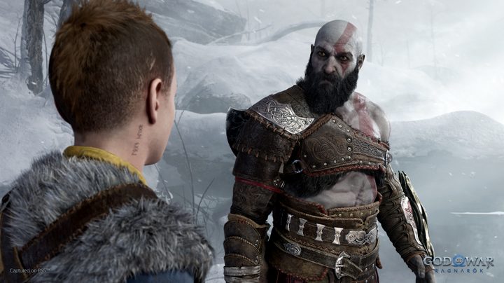 Kratos sternly looks at Atreus in God of War: Ragnarok.
