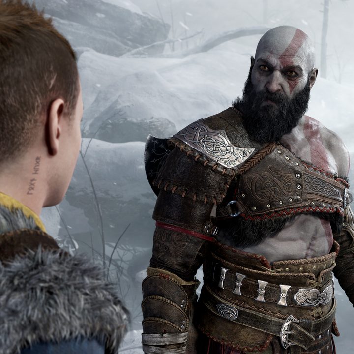 Kratos sternly looks at Atreus in God of War: Ragnarok.