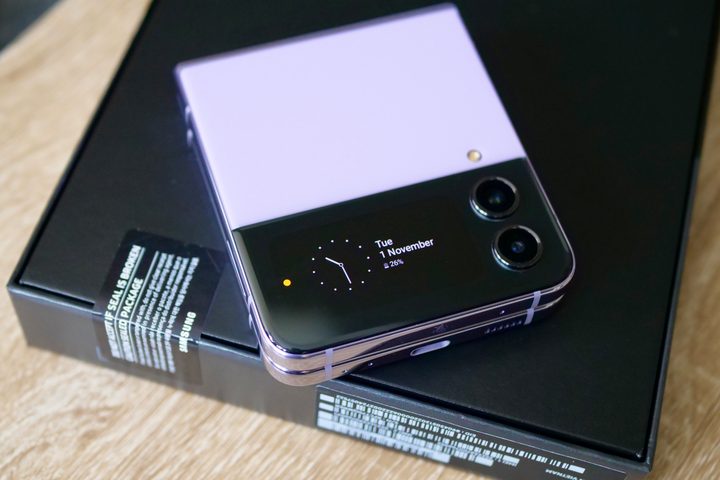 Galaxy Z Flip 4 closed on top of a Galaxy Z Fold 4's box.