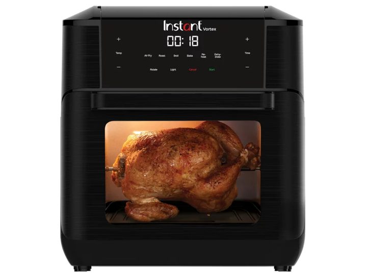 Instant Vortex 10-Quart Air Fryer Oven cooking a rotisserie chicken.