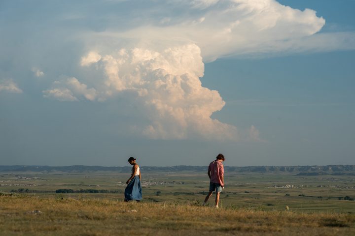 Maren and Lee walk in opposite directions through midwestern plains in Bones and All.