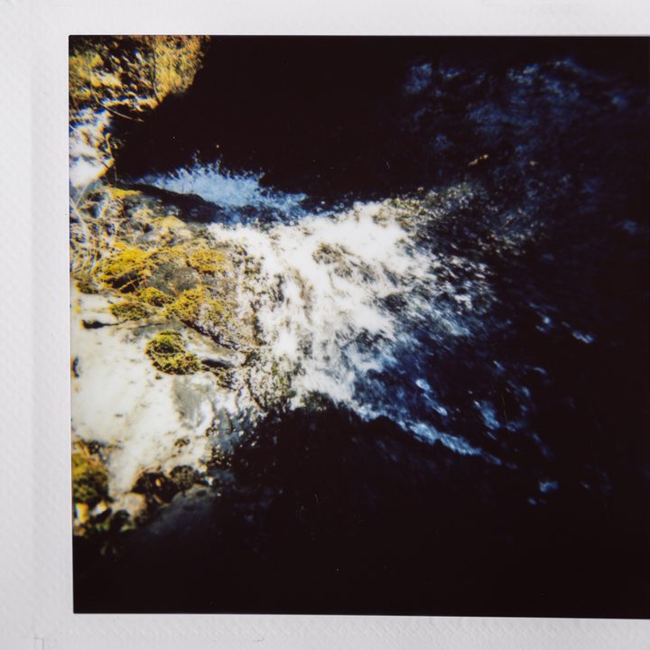 Instax photo of a waterfall.