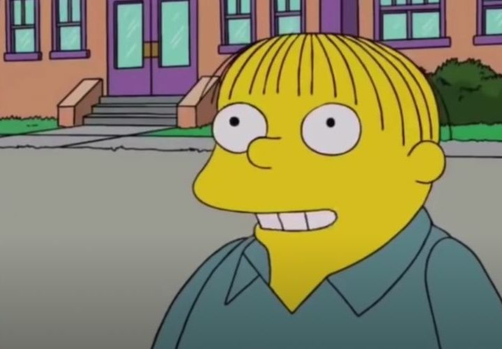 Ralph Wiggum stands in front of Springfield Elementary