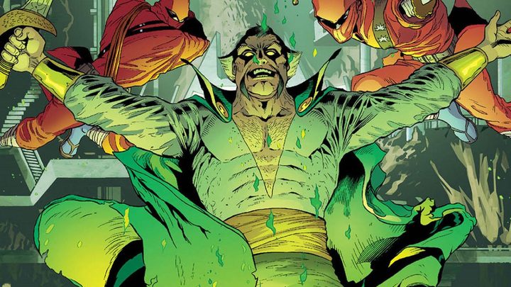 Ra's Al Ghul spreading his arms while two ninjas jump behind him in DC Comics.